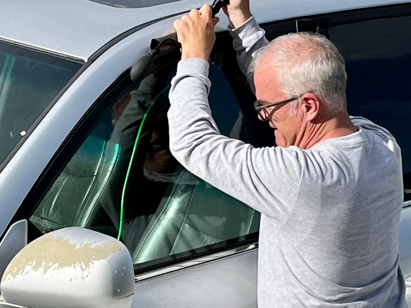 a locksmith opening a car